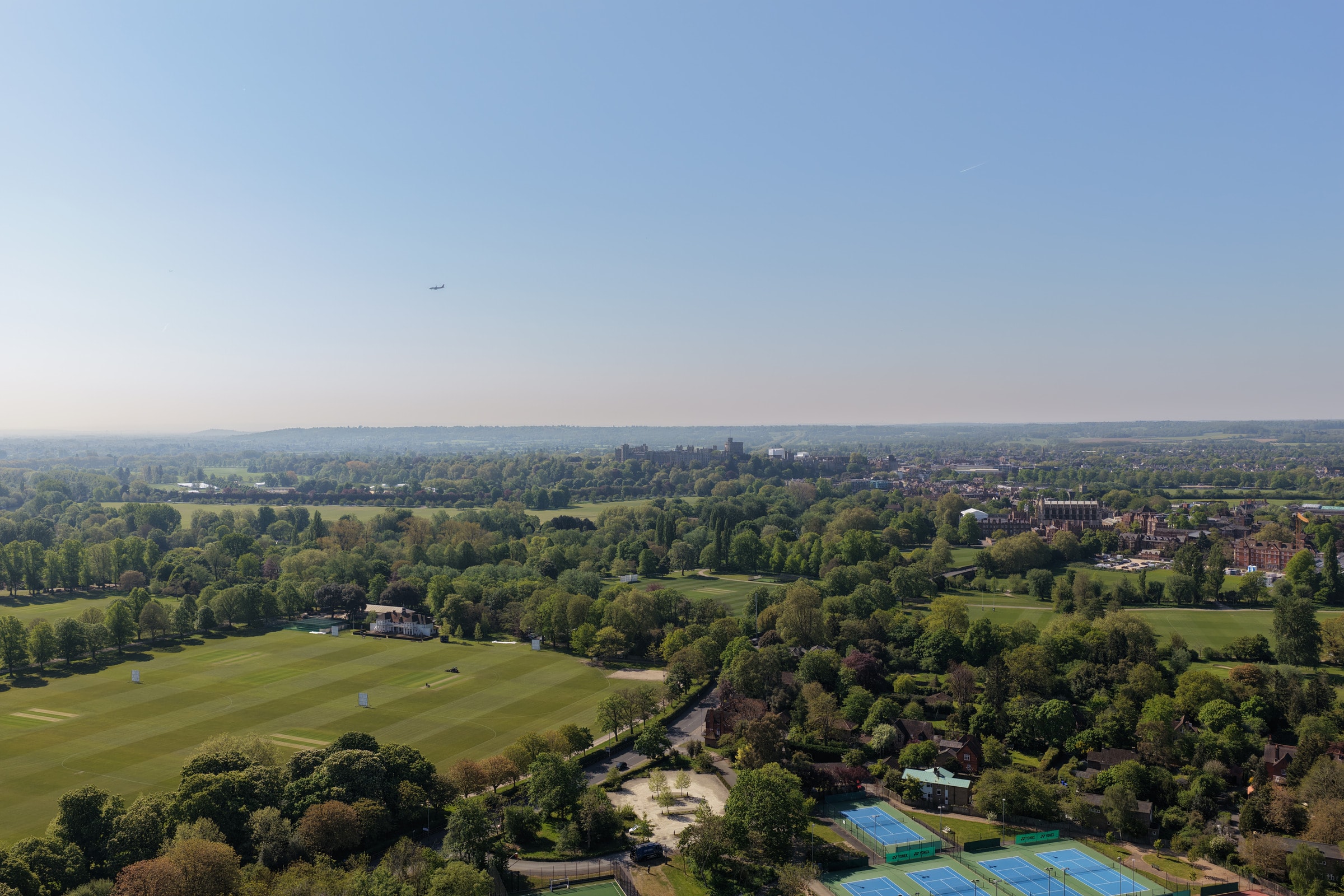 Aerial view towards Windsor Castle, across parkland and tennis courts